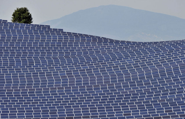 A picture taken on May 9, 2011 in Les Mees, southern France shows solar panels. France on October 13, 2011 launched its largest-ever solar energy farm, with an array of panels spread over about 200 hectares (500 acres) in the mountainous southern Alpes-de-Haute-Provence region. With a production capacity of 90 megawatts, the vast photovoltaic park features nearly 113,000 solar panels and was built at a cost of 110 million euros ($137 million). (Photo by Boris Horvat/AFP Photo via Getty Images)
