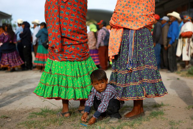 Raramuri Indigenous people wait to vote at a polling station on the day of the general elections, in the town of Norogachi, in the state of Chihuahua, Mexico on June 2, 2024. (Photo by Jose Luis Gonzalez/Reuters)