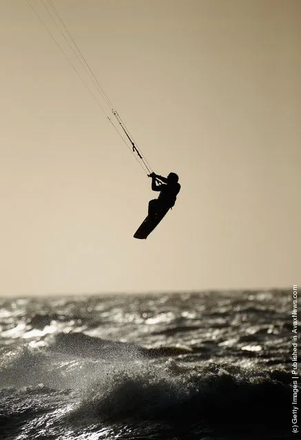 A kite surfer takes advantage of high winds and waves off Blackpool seafront