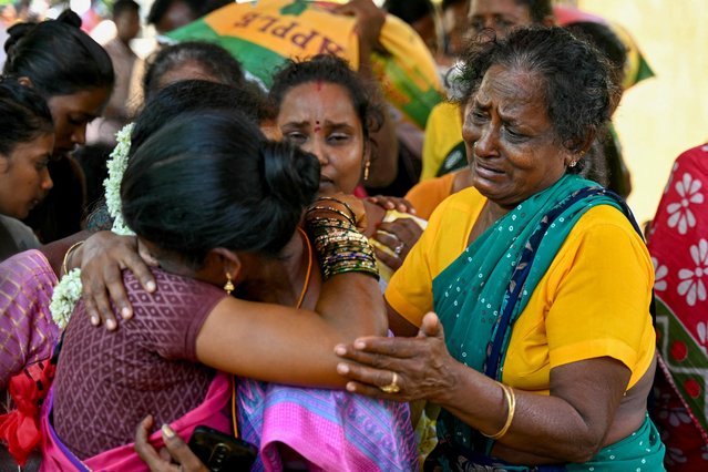 Relatives mourn near the deceased who consumed toxic alcohol in Kallakurichi district of India's Tamil Nadu state on June 24, 2024. The death toll from a batch of toxic illegal alcohol in India had risen to 56, police said on June 24, with 117 people in hospital recovering from the deadly drink. (Photo by R. Satish Babu/AFP Photo)