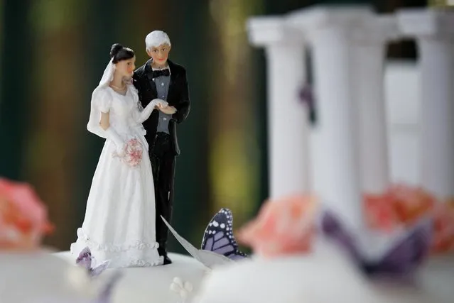 A view shows figurines on a wedding cake on the day of WikiLeaks founder Julian Assange and Stella Moris' wedding at HMP Belmarsh prison, in London, Britain, March 23, 2022. (Photo by Peter Nicholls/Reuters)