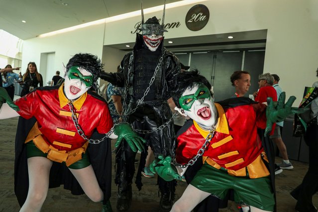 Cosplayers pose for a picture during Comic-Con International in San Diego, California on July 27, 2024. (Photo by Sandy Huffaker/Reuters)