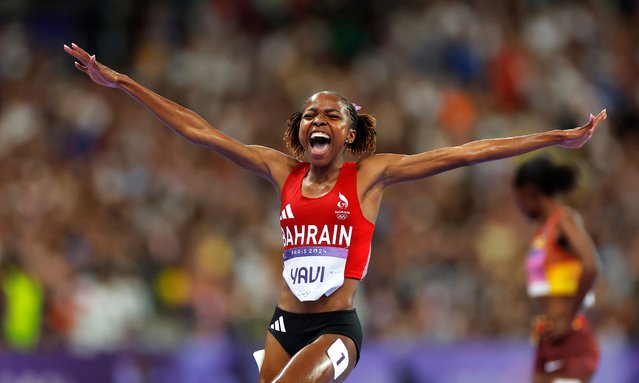 Winfred Yavi of Bahrain celebrates after winning the women's 3,000-meter steeplechase final at the Paris Olympics on Aug. 6, 2024, at Stade de France in Saint-Denis, near Paris. (Photo by Tom Jenkins/The Guardian)