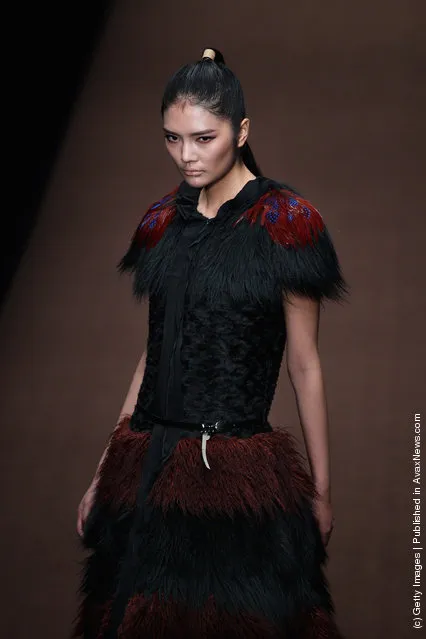 A model showcases designs on the catwalk during Magic Fur Wu Xuekai Collection A/W 2012-2013 of China Fashion Week at 751D.Park Workshop