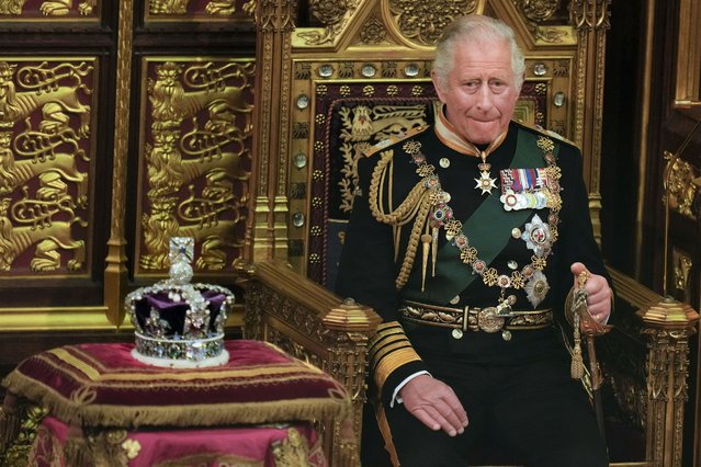 Prince Charles is seated next to the Queen's crown during the State Opening of Parliament, at the Palace of Westminster in London, Tuesday, May 10, 2022. Queen Elizabeth II did not attend the opening of Parliament amid ongoing mobility issues. (Photo by Alastair Grant/Pool via AP Photo)