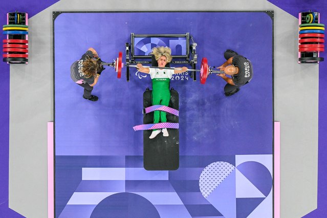 Algeria's Samira Guerioua competes in the women's Powerlifting up to 45kg final during the Paris 2024 Paralympic Games, at La Chapelle Arena in Paris, on September 4, 2024. (Photo by François-Xavier Marit/AFP)