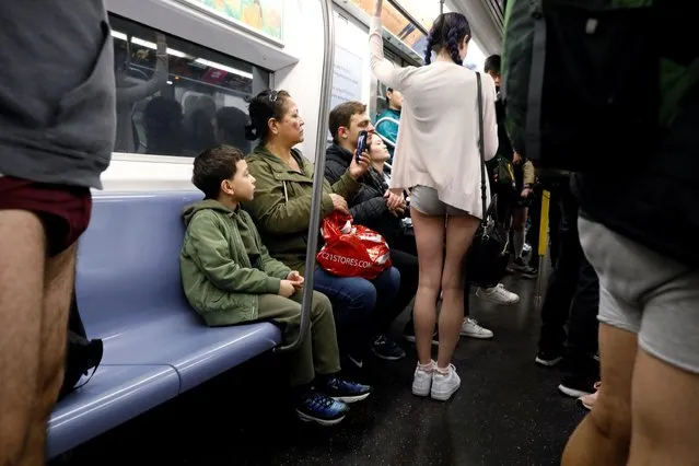 People participate in the annual “No Pants Subway Ride” in New York City, U.S., January 12, 2020. (Photo by Brendan McDermid/Reuters)