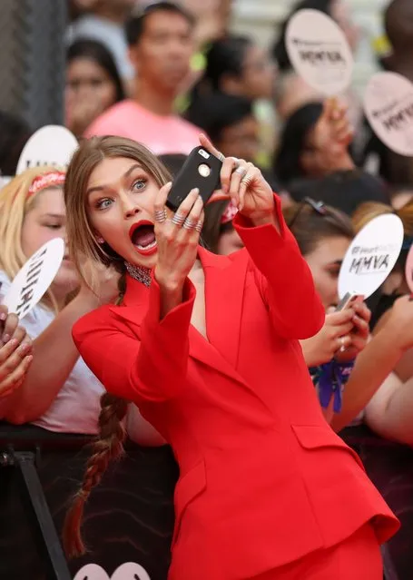 MMVA host model Gigi Hadid takes pictures with fans as she arrives for the iHeartRadio Much Music Video Awards (MMVAs) in Toronto, Ontario, Canada June 19, 2016. (Photo by Peter Power/Reuters)