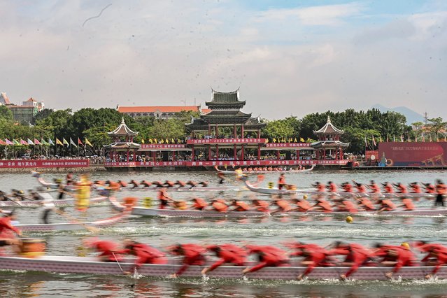 Dragon boat crew members compete in a traditional Chinese dragon boat race held in Xiamen City, southeast China's Fujian Province, June 3, 2022. To celebrate China's traditional Dragon Boat Festival, over 1,000 participants from both sides of the Taiwan Strait compete in a dragon boat race from Thursday to Friday in the coastal city of Xiamen in Fujian Province. (Photo by Xinhua News Agency/Rex Features/Shutterstock)