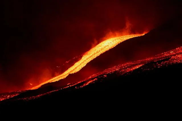 Lava flows downhill as Mount Etna erupts, as seen from Pizzi Deneri on the north side of volcano, on the island of Sicily, in Catania, Italy, May 31, 2022. (Photo by Antonio Parrinello/Reuters)