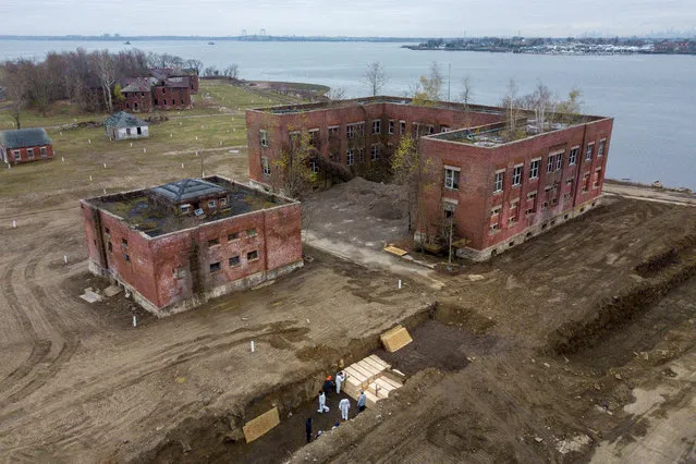 Drone pictures show bodies being buried on New York's Hart Island where the department of corrections is dealing with more burials overall, amid the coronavirus disease (COVID-19) outbreak in New York City, U.S., April 9, 2020. (Photo by Lucas Jackson/Reuters)