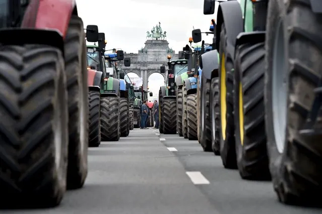 Tractors are seen in central Brussels as farmers and dairy farmers from all over Europe take part in a demonstration outside a European Union farm ministers' emergency meeting at the EU Council headquarters in Brussels, Belgium September 7, 2015. (Photo by Eric Vidal/Reuters)