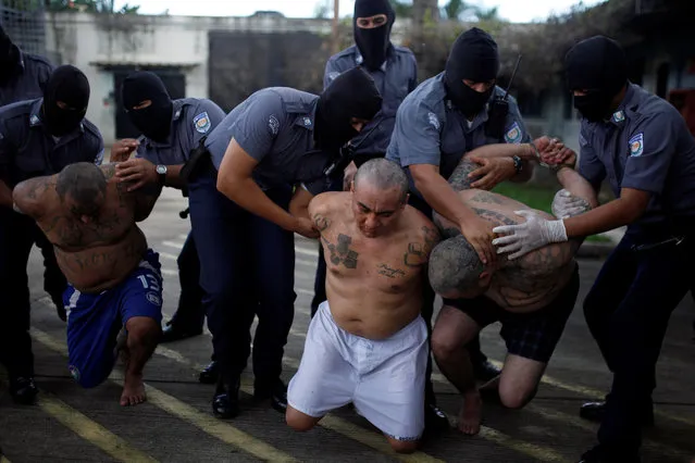 Mara Salvatrucha (MS-13) gang members wait to be escorted upon their arrival at the maximum-security jail in Zacatecoluca, El Salvador on Octoner 13, 2017. (Photo by Jose Cabezas/Reuters)
