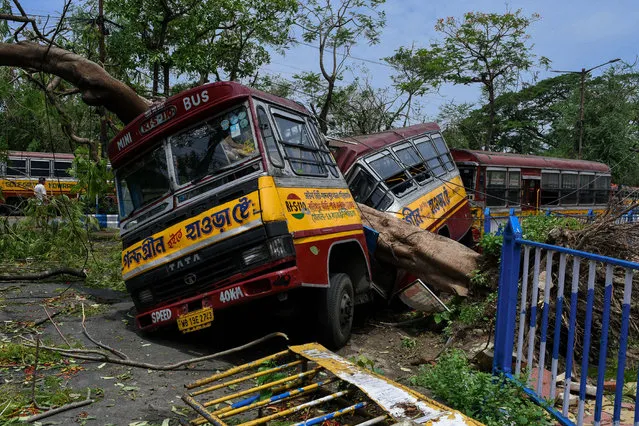 A private bus being crushed in half by a fallen tree due to Cyclone Amphan in Kolkata, West Bengal, India on May 22, 2020. The wreckage still exists after two day since Super cyclone Amphan hit the States of Bengal and Orissa.There are massive destruction of properties and life.All together the cyclone claimed about 76 lives across India and Bangladesh. The CM of West bengal has declared a package of 2.5 Lakhs for the family of the deceased in the state. (Photo by Debarchan Chatterjee/ZUMA Wire/Rex Features/Shutterstock)