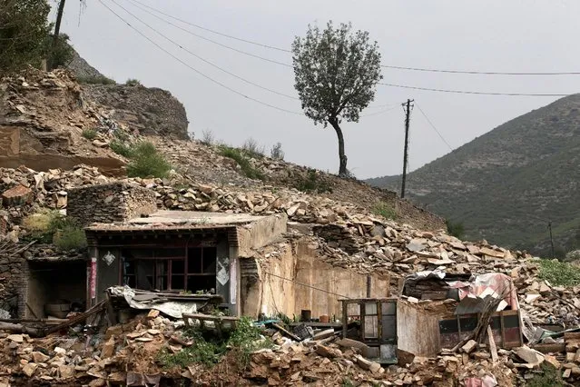 An abandoned workers' dormitory is seen next to a coal mine in an area where land is sinking in Yongdingzhuang village of Datong, China's Shanxi province, August 1, 2016. (Photo by Jason Lee/Reuters)