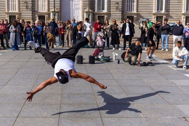 A street performer dances in Madrid's Plaza de Oriente in exchange for tips from tourists on February 16, 2025. (Photo by David Canales/SOPA Images/Rex Features/Shutterstock)