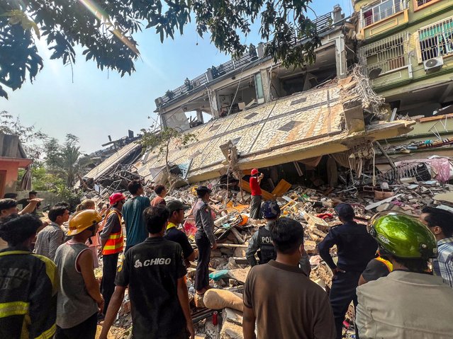 Rescue personnel work at the site of a building that collapsed, following a strong earthquake, in Mandalay, Myanmar, on March 29, 2025. (Photo by Reuters/Stringer)