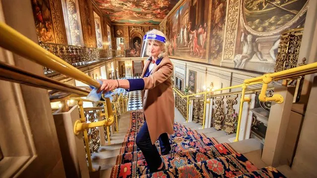 Visitor Welcome Supervisor Lizzie Ross makes final preparations in the Painted Hall at Chatsworth House in Bakewell, Derbyshire on July 23, 2020, which reopens to the public on Monday after the lifting of further coronavirus lockdown restrictions in England. (Photo by Danny Lawson/PA Images via Getty Images)