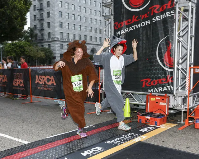 General view of runners preparing to cross the finish line at the Rock 'n' Roll Los Angeles Halloween Half-Marathon and 5K benefitting the ASPCA on October 26, 2014 in Los Angeles, California. (Photo by Rich Polk/Getty Images for CGI)