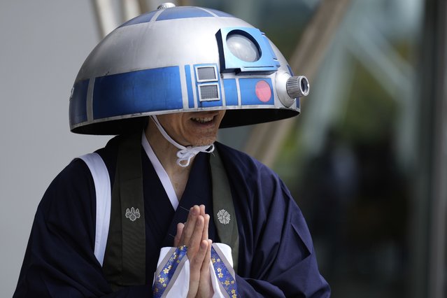 A Star Wars fan in an R2-D2 costume poses for a photo outside the venue during a fan convention called the Star Wars Celebration in Chiba, near Tokyo, Friday, April 18, 2025. (Photo by Hiro Komae/AP Photo)