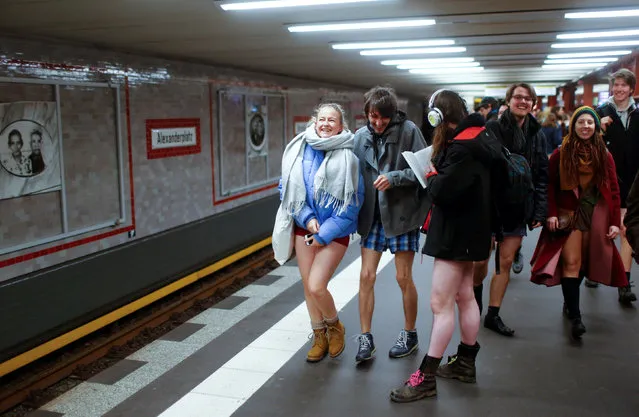 People take part in the annual flash mob “No Pants Subway Ride” in Berlin, Germany, January 7, 2018. (Photo by Hannibal Hanschke/Reuters)