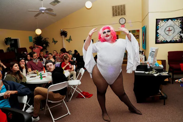 Mistah Aphrodite performs while she receives tips for charity before hosting her Bingo with Momma and Friends event held at the Unitarian Universalist Congregation of Lakeland in Lakeland, Florida, U.S. December 15, 2022. (Photo by Octavio Jones/Reuters)