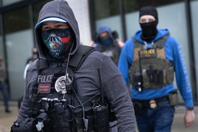 Homeland Security police prepare to transport immigrants who were taken into custody at the offices of a hHomeland Security contractor on June 04, 2025 in Chicago, Illinois. About a dozen immigrants were taken into custody after reporting to appointments at BI Incorporated, a company that contracts with government agencies to provide electronic monitoring.  (Photo by Scott Olson/Getty Images)