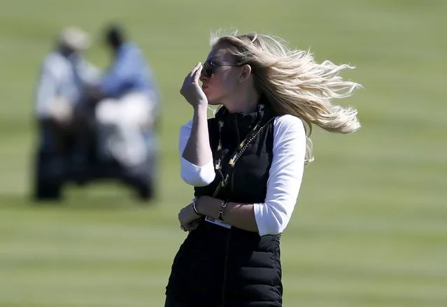 Paulina Gretzky, fiancee of U.S. team member Dustin Johnson, reacts after Johnson and team member Jordan Spieth were defeated by international team members Louis Oosthuizen and  Branden Grace of South Africa on the 15th hole during the four ball matches of the 2015 Presidents Cup golf tournament at the Jack Nicklaus Golf Club in Incheon, South Korea, October 9, 2015. (Photo by Toru Hanai/Reuters)