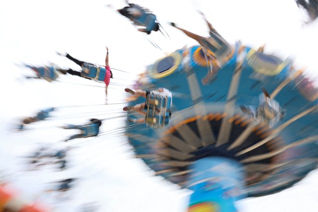 People ride on flying chairs while visiting Legoland Shanghai Resort for the pre-opening, during a media tour ahead of the theme park’s opening set on July 5, in Shanghai, China on June 20, 2025. (Photo by Go Nakamura/Reuters)