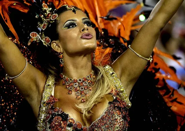 Drum queen Lucilene Caetano, from the Inocentes de Belford Roxo samba school, dances at the Sambadrome in Rio de Janeiro. (Photo by Silvia Izquierdo/Associated Press)