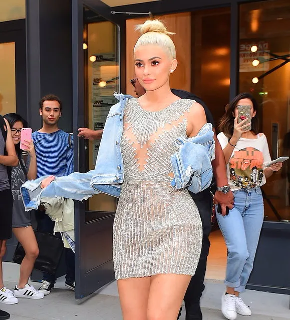 Kylie Jenner looked beautiful as she left her NYC Airbnb  on September 9, 2016, wearing a Jeweled silver dress with a ripped jean jacket. She walked passed fans and paparazzi as she headed to her car , en route to a Fashion Show. (Photo by 247PAPS.TV/Splash News)
