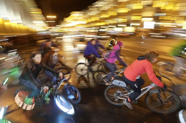 Belarusians participate in a cycle rally during a Car Free Day in Minsk, Belarus, Thursday, September 22, 2016. The idea of the World Car Free Day propose for motorists to give up their car for a day and use bicycles instead. (Photo by Sergei Grits/AP Photo)