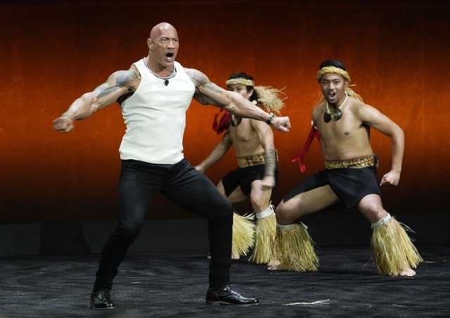 American actor Dwayne “The Rock” Johnson dances onstage before introducing a clip from the upcoming animated film “Moana 2” during the Walt Disney Studios presentation at CinemaCon 2024, at Caesars Palace in Las Vegas, April 11, 2024. (Photo by Chris Pizzello/AP Photo)
