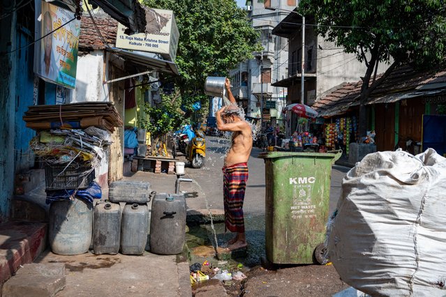 A man cools off in street tap water during the heat wave. Severe heat wave warning issued by The India Meteorological Department (IMD) in some districts of the Southern part of West Bengal, India on April 25, 2024. On 25th of April the highest temperature recorded was 42 degree Celsius which was approximately 6 degrees higher than the normal. IMD experts also said this to be continued till 28th April, 2024 due to dry wind which continues to blow at lower level from west and north west India over the region. The extreme heat is becoming unbearable for the people. (Photo by Jit Chattopadhyay/SOPA Images/Rex Features/Shutterstock)