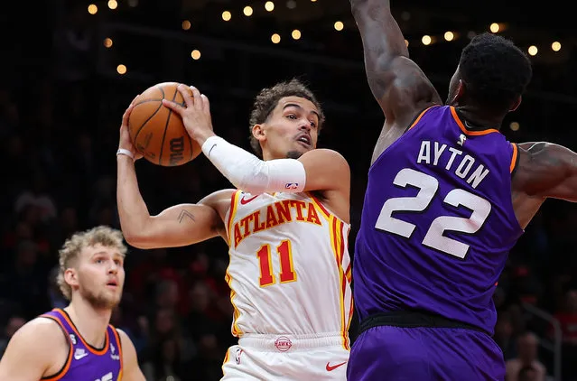 Trae Young #11 of the Atlanta Hawks drives against Deandre Ayton #22 of the Phoenix Suns during the second quarter at State Farm Arena on February 09, 2023 in Atlanta, Georgia. (Photo by Kevin C. Cox/Getty Images)