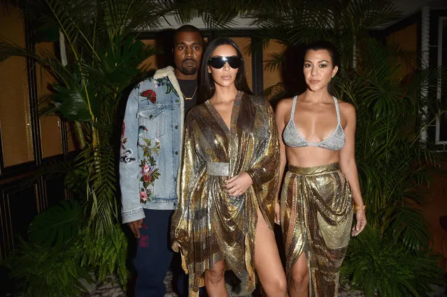 (L to R) Kanye West, Kim Kardashian and Kourtney Kardashian attend the Balmain aftershow party as part of the Paris Fashion Week Womenswear Spring/Summer 2017 on September 29, 2016 in Paris, France. (Photo by Jacopo Raule/Getty Images)