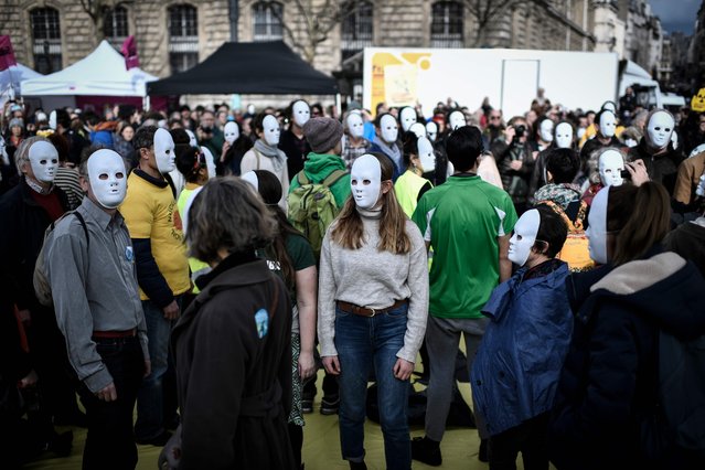 Environmental activists take part in a demonstration called by associations to mark the seventh anniversary of the Fukushima nuclear disaster in Japan, on March 11, 2018 in Paris. The deadly earthquake, tsunami and nuclear disaster seven years ago devastated Japan's northeastern coast and left around 18,500 people dead or missing. (Photo by Stephane De Sakutin/AFP Photo)