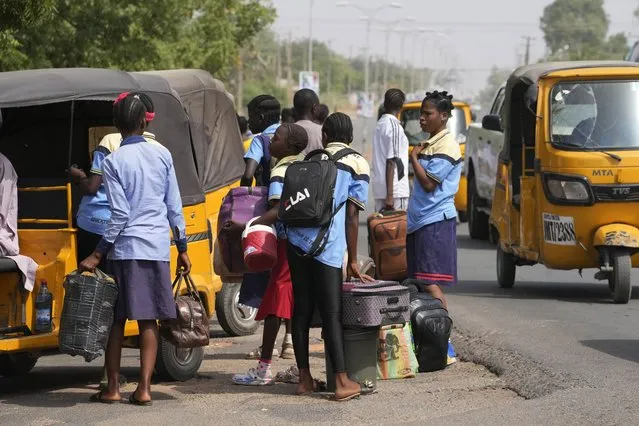 Students of government girls secondary Yola, ride home following the closures of schools by government before the elections in Yola, Nigeria Thursday, February 23, 2023. (Photo by Sunday Alamba/AP Photo)