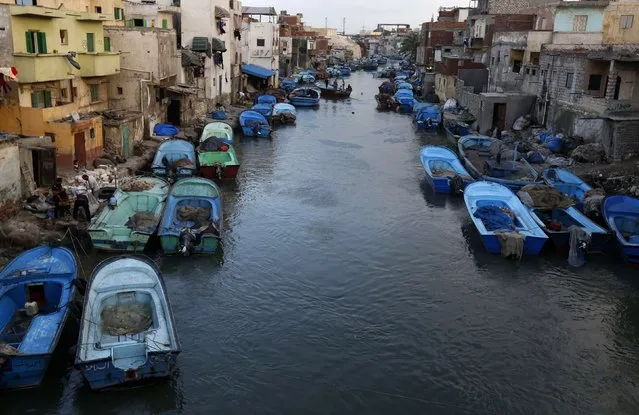 Boats are seen moored in front of houses in the fishermen's village in El Max in the Mediterranean city of Alexandria October 18, 2014. (Photo by Amr Abdallah Dalsh/Reuters)