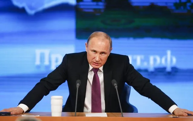 Russian President Vladimir Putin speaks during his annual end-of-year news conference in Moscow, December 18, 2014. The rouble edged lower against the dollar on Thursday, with traders saying President Vladimir Putin had offered few concrete measures at his end-of-year news conference to pull Russia out of a crisis. (Photo by Maxim Zmeyev/Reuters)