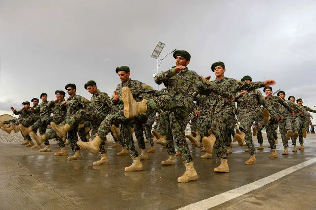 This photo taken on April 15, 2018 shows Afghan National Army (ANA) soldiers marching during a training exercise of a graduation ceremony at a training center in Herat province. (Photo by Hoshang Hashimi/AFP Photo)