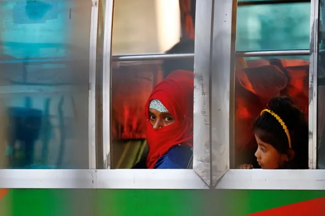 Rohingyas that will be shifted to Bhasan Char island are seen onboard a bus in Chattogram, Bangladesh, December 4, 2020. (Photo by Mohammad Ponir Hossain/Reuters)
