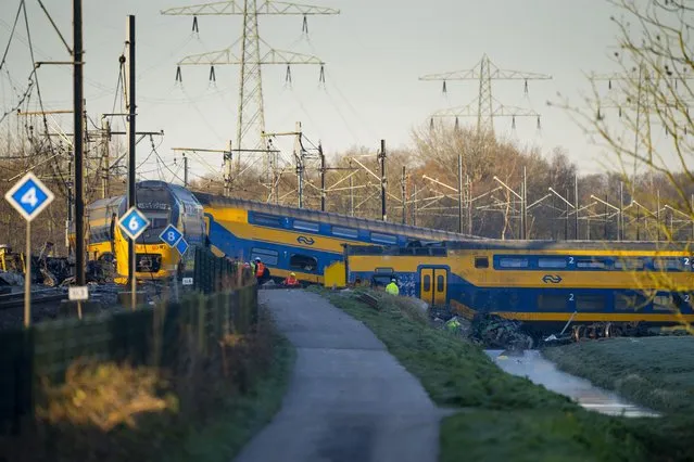 At least one person died and some 30 passengers were injured in the early hours when a train partially derailed, in Voorschoten, near The Hague, Tuesday April 4, 2023, sending at least one carriage into a field next to the tracks. (Photo by Peter Dejong/AP Photo)