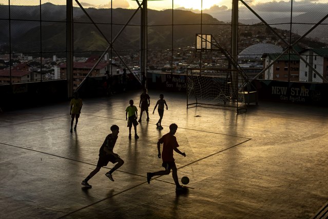 Young people play soccer on a field in the working-class neighborhood of San Agustin in Caracas, Venezuela, 09 December 2025. (Photo by Miguel Gutierrez/EPA)