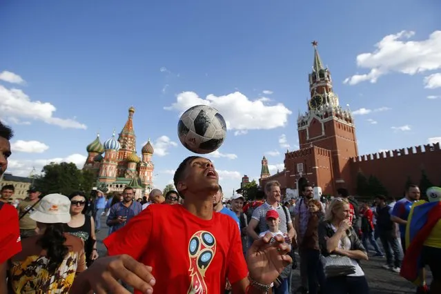 Morocco soccer fan plays with the ball at the Red Square after the matchgroup B match between Portugal and Morocco at the 2018 soccer World Cup at the Luzhniki Stadium in Moscow, Russia, Wednesday, June 20, 2018. (Photo by Sergei Karpukhin/Reuters)
