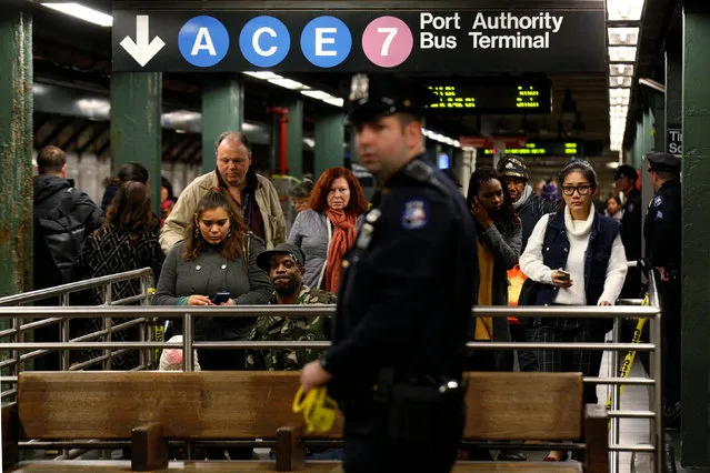 Members of the New York City police (NYPD) work at the scene after a commuter was pushed in front of a subway train as it arrived at Times Square station in New York City, U.S., November 7, 2016. (Photo by Brendan McDermid/Reuters)