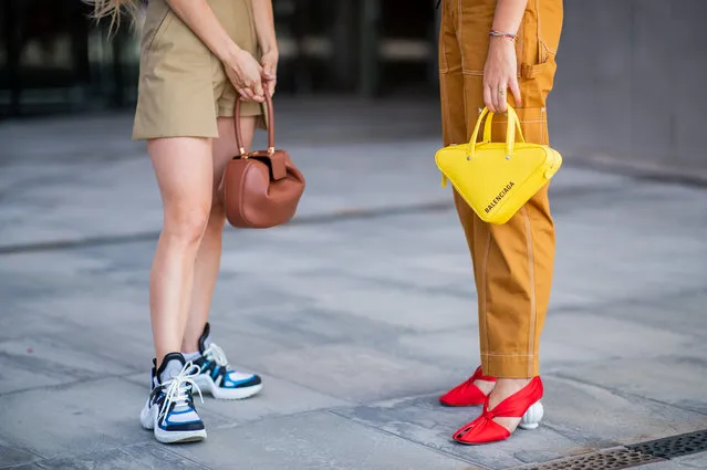 Trine Kjaer wearing yellow Balenciaga triangle bag is seen outside Designers Remix during the Copenhagen Fashion Week Spring/Summer 2019 on August 9, 2018 in Copenhagen, Denmark. (Photo by Christian Vierig/Getty Images)