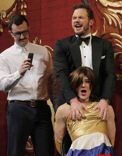 Actor Chris Pratt (top R) grabs male student cast member Matthew Walker (bottom R), with fellow cast member Karl Kopczynski looking on, as Pratt is roasted and honored as Hasty Pudding Theatricals' Man of the Year at Harvard University in Cambridge, Massachusetts February 6, 2015. The skit was taken from the movie “Her”. (Photo by Brian Snyder/Reuters)