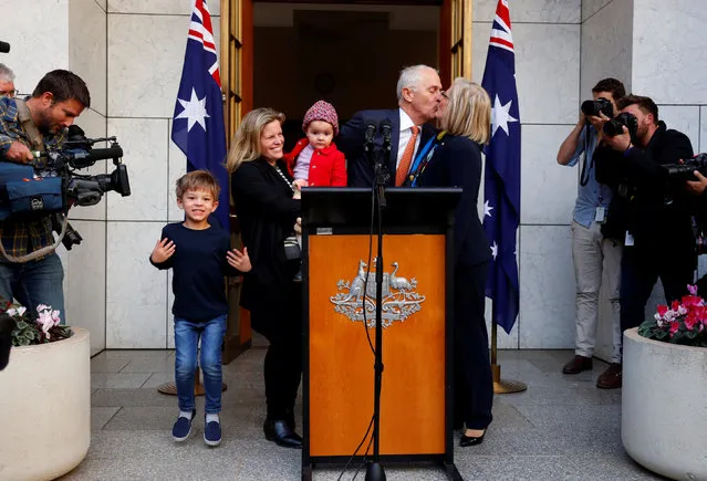 Former Australian prime minister Malcolm Turnbull kisses his wife Lucy, while standing with daughter Daisy, and grandchildren Alice and Jack after a news conference in Canberra, Australia August 24, 2018. (Photo by David Gray/Reuters)