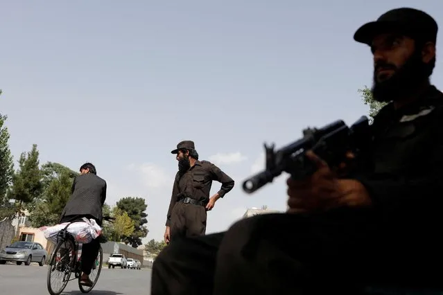 Taliban soldiers stand guard at a checkpoint in Kabul, Afghanistan on July 6, 2023. (Photo by Ali Khara/Reuters)
